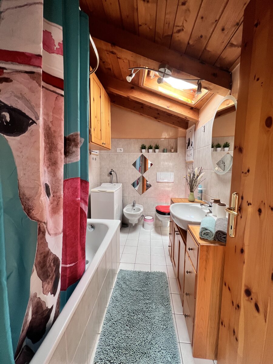 Mansard bathroom with bathtub, bidet and washbasin
