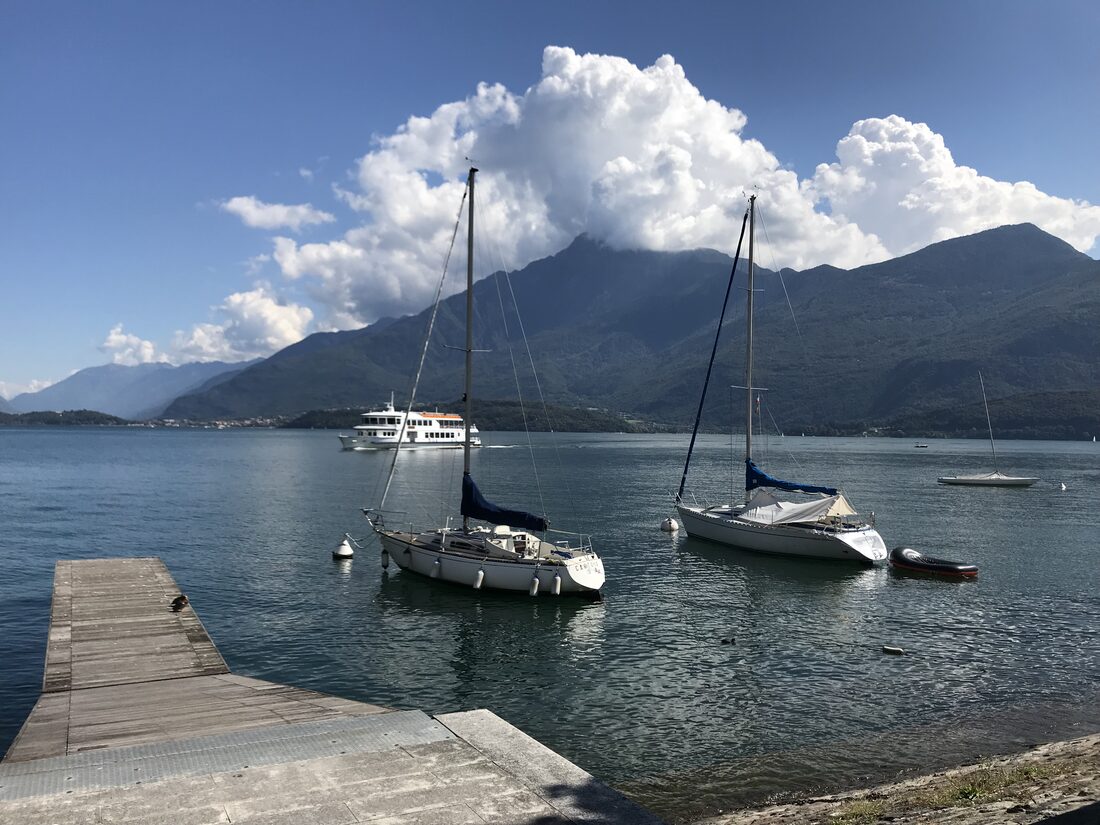 Sailboats moored at Gravedona with mountains behind