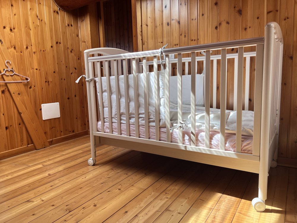 Crib set up in the bedroom on request