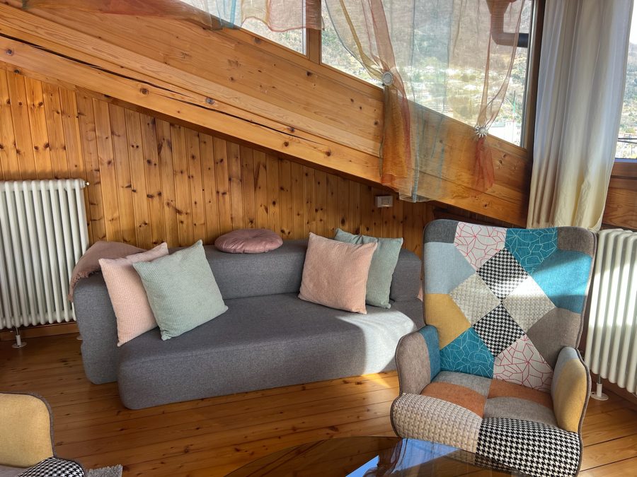The same sofa by day, with pastel cushions in the living room